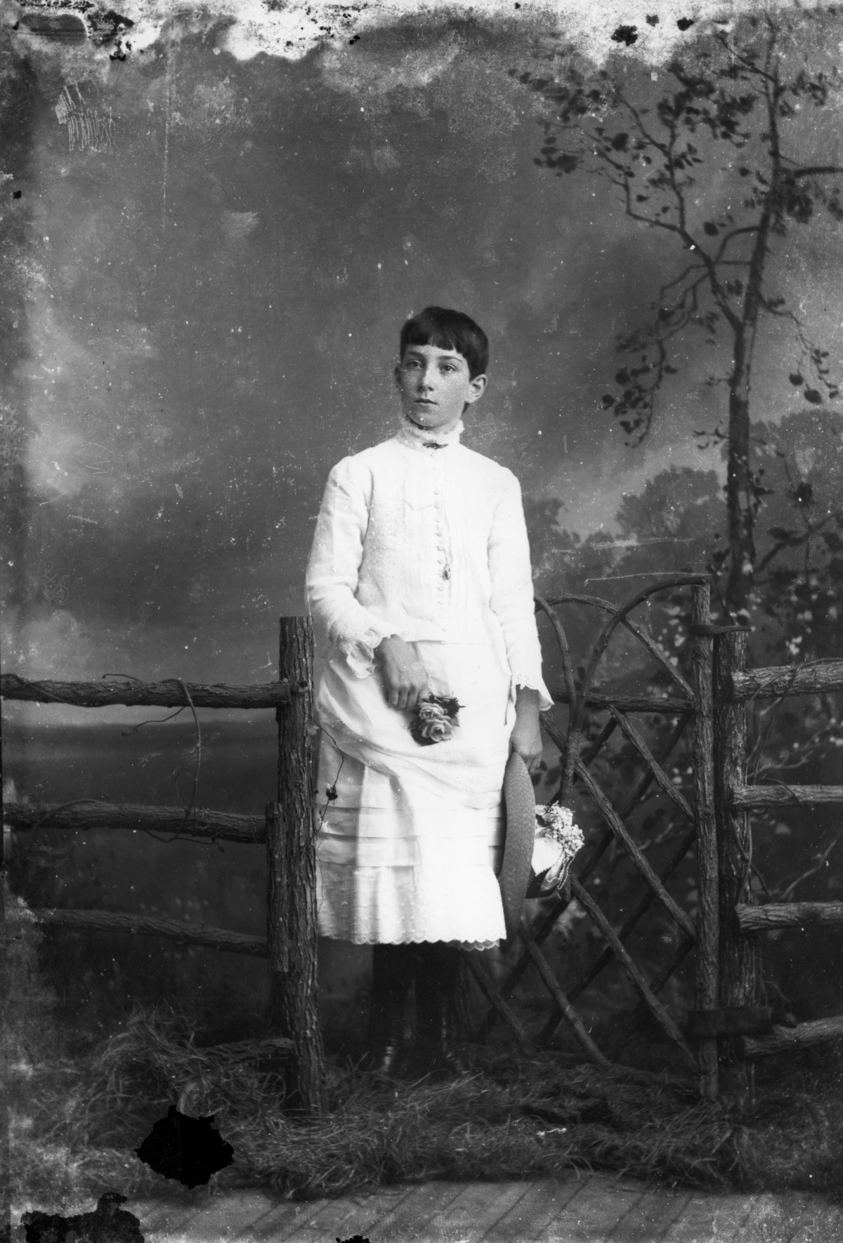Olivette Head? holding a hat.