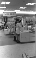 Employees dressing mannequin in a clothing store at the Northwood Mall - Tallahassee, Florida.