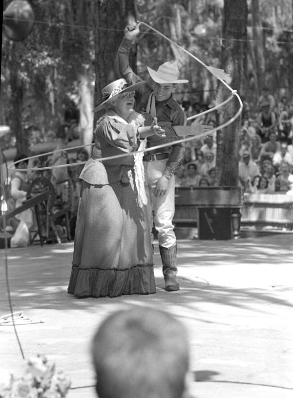 View of trick roper Danny Coflin performing with Thelma Boltin at the 1970 Florida Folk Festival - White Springs, Florida.