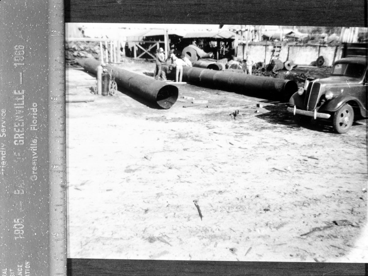 Workers with smokestacks at Page sawmill - Greenville, Florida