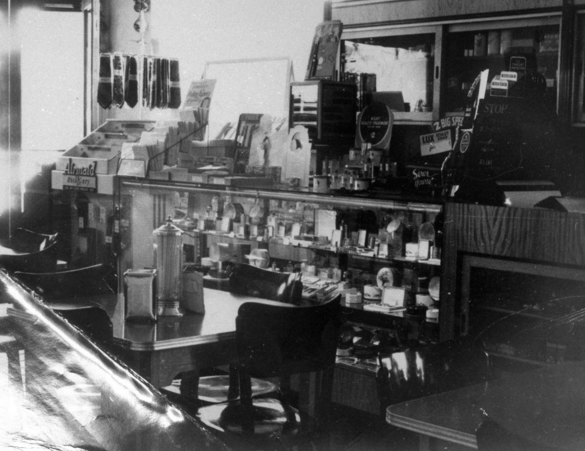 Inside view of tables and counter of sundries at Coggins' luncheonette - Madison County, Florida