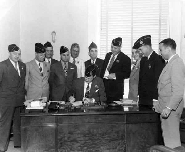 Governor Caldwell with members of the American Legion .