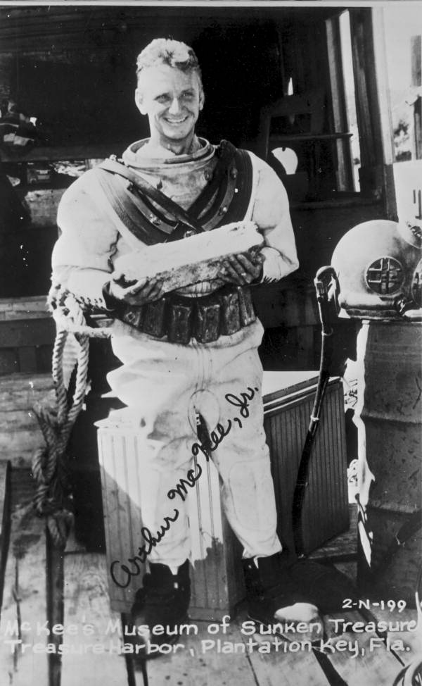 Postcard of treasure hunter Art McKee holding silver bar retrieved from "El Capitana" wreck - Plantation Key, Florida