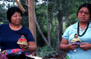 Mary Billie and her daughter Claudia C. John holding handmade Seminole dolls : Big Cypress Seminole Indian Reservation, Florida