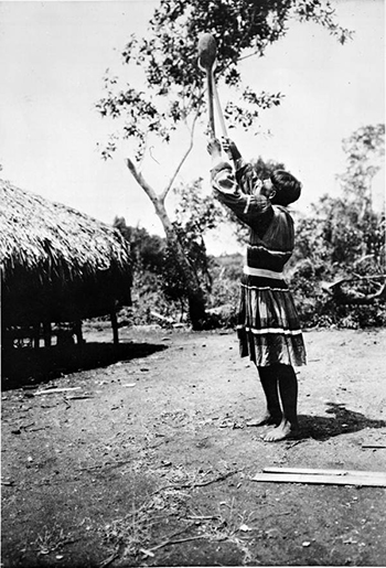 Ingraham Charlie posing with wooden ball sticks at Jack Tigertail&rsquo;s camp (1910)