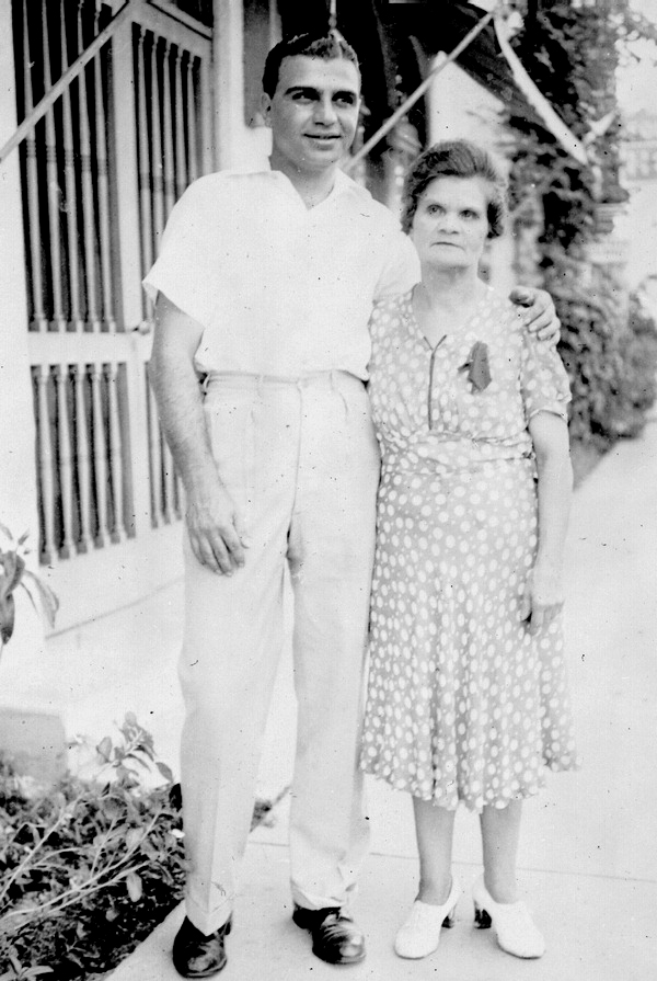 Al Sutton and his mother outside her dress shop.