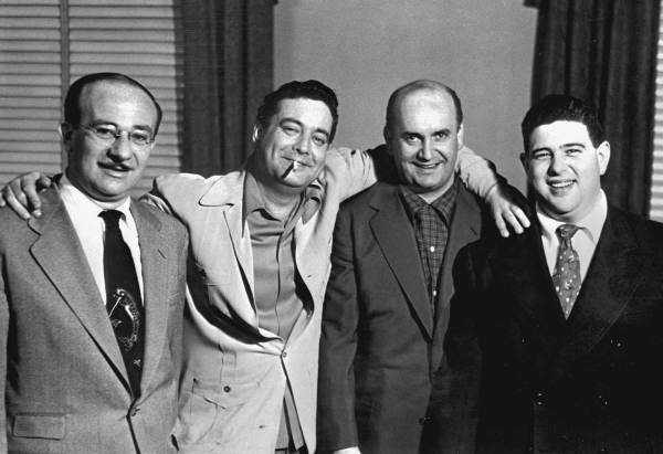 Jackie Gleason with television script writers.
