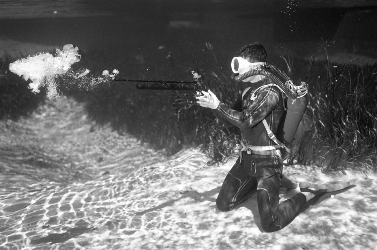 Ricou Browning shooting speargun underwater at Silver Springs.