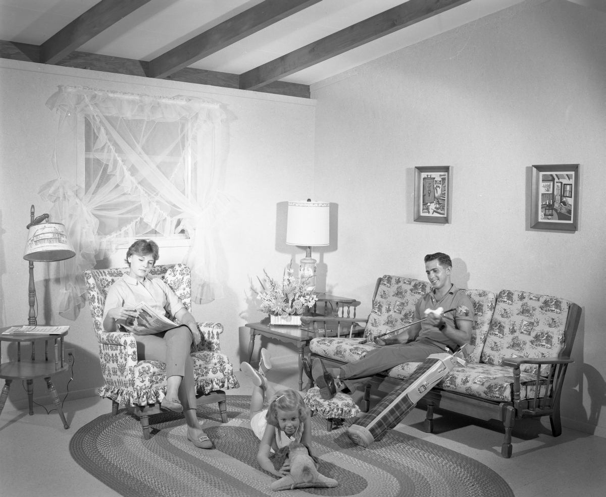 Family in the living room at the Vaught house in Belleview.