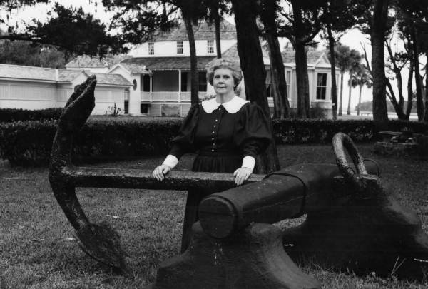 Tour guide Frances Duncan posing behind Kingsley Plantation - Jacksonville, Florida.