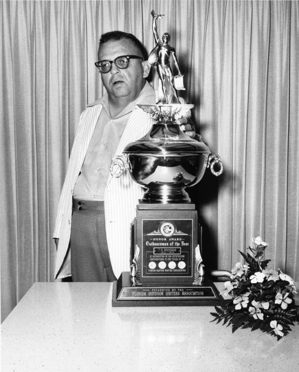 Sports writer Tommy Anderson with his Outdoorsman of the Year award from the Florida Outdoor Writers Assn.