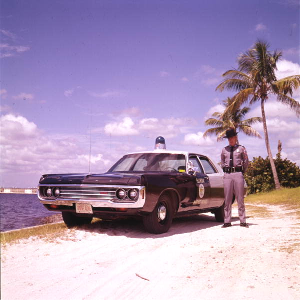 Florida Marine Patrol officer with his vehicle