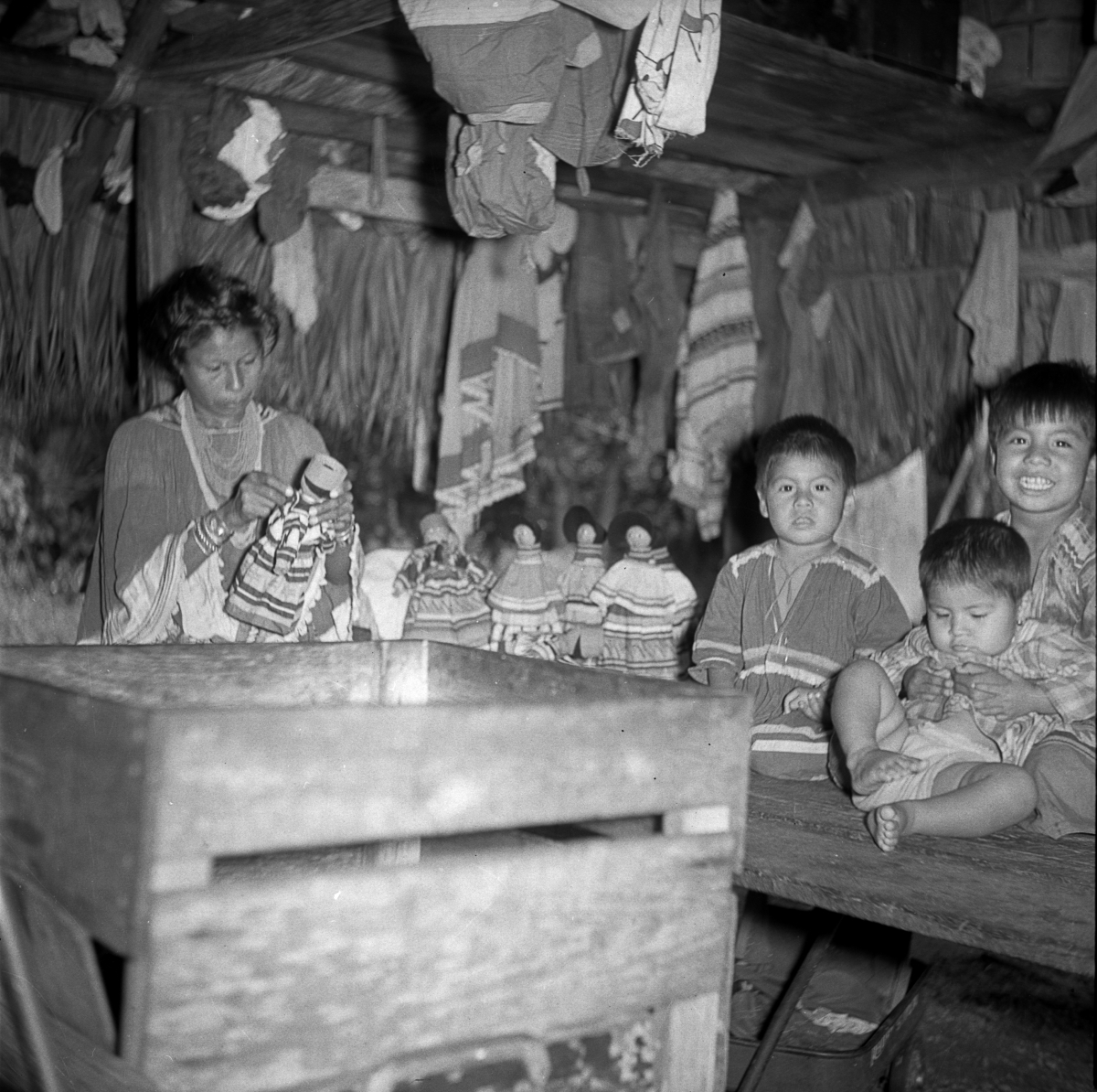 Seminole woman making dolls