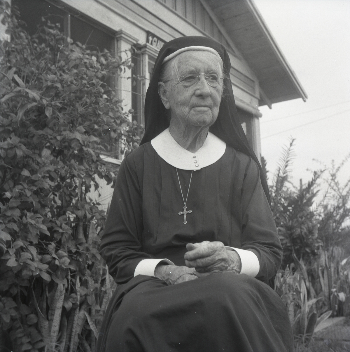 Deaconess Harriet Bedell sitting in front of the Glade Cross Mission