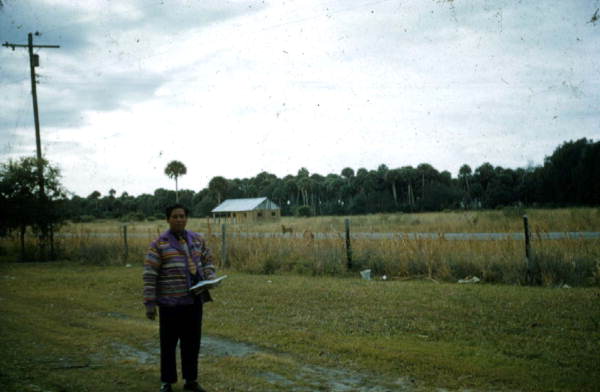 Seminole Indian man reading a book