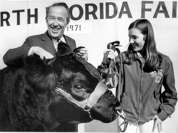 U.S. Senator Henry "Scoop" Jackson from Washington with a prize winning bull and its owner.