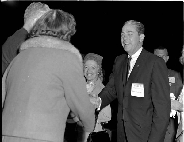 Former Florida Governor Haydon Burns and his wife, Mildred, greeting people.