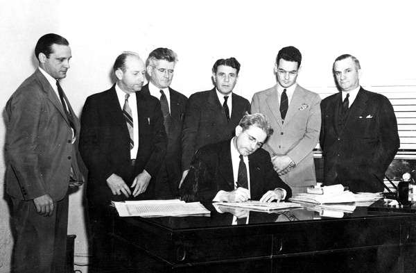 Florida Governor Spessard Holland signing a bill.