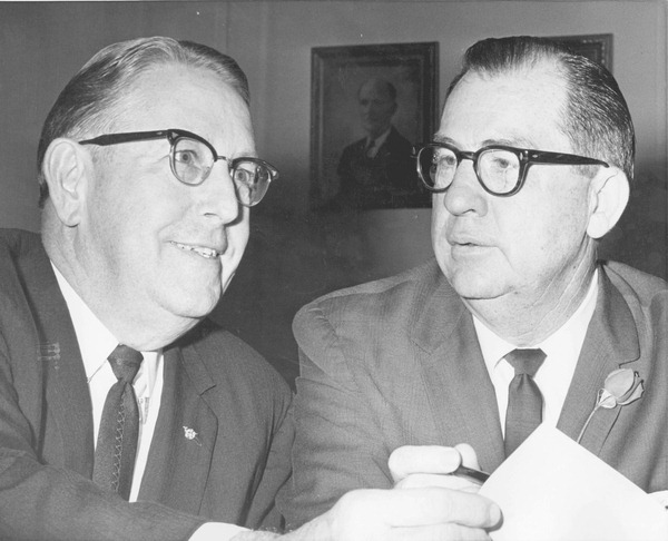 Acting Florida Governor, Senator Charley E. Johns looking over some papers