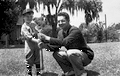 LeRoy Collins Junior in a baseball uniform holding a bat with Dan McCarty.