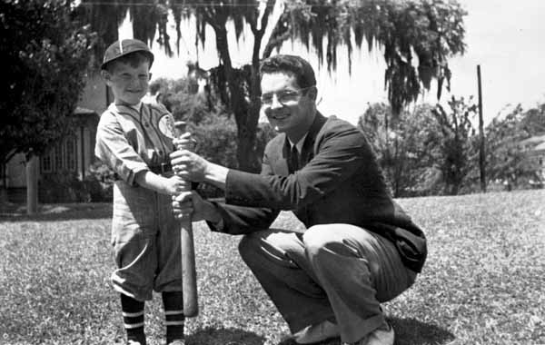 LeRoy Collins Junior in a baseball uniform holding a bat with Dan McCarty.