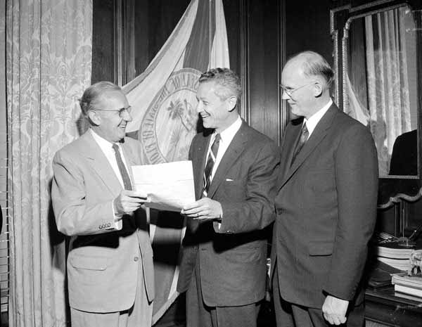Florida Governor LeRoy Collins looking over paperwork