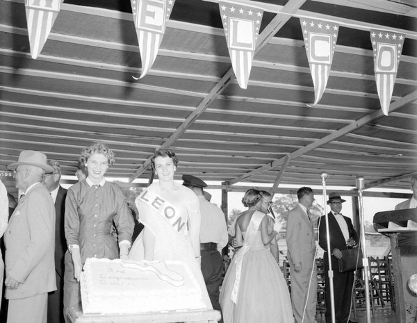 Women holding a cake