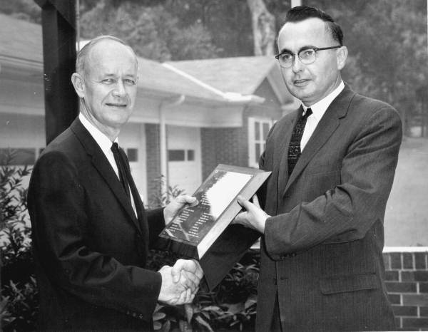 Florida Governor Farris Bryant holding a plaque.