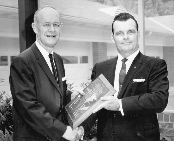 Florida Governor Farris Bryant holding a plaque.