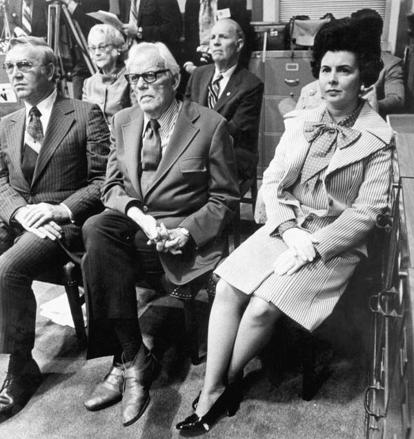 Florida Governor Askew's wife listens as her husband addresses the legislature.