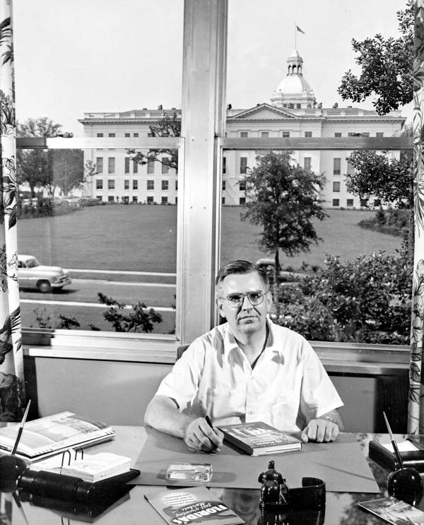 Allen Morris at a desk by the old capitol building - Tallahassee, Florida