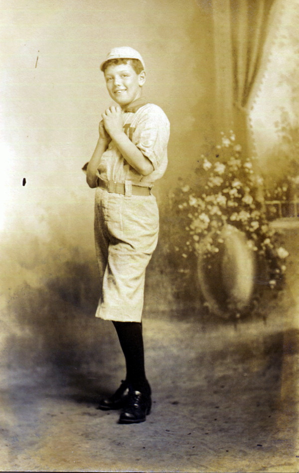 Boy posing in baseball uniform