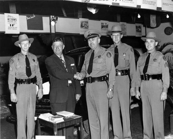 Florida Highway Patrolmen with American Legion Commander Dave Turner at the 1947 Broward County Fair.