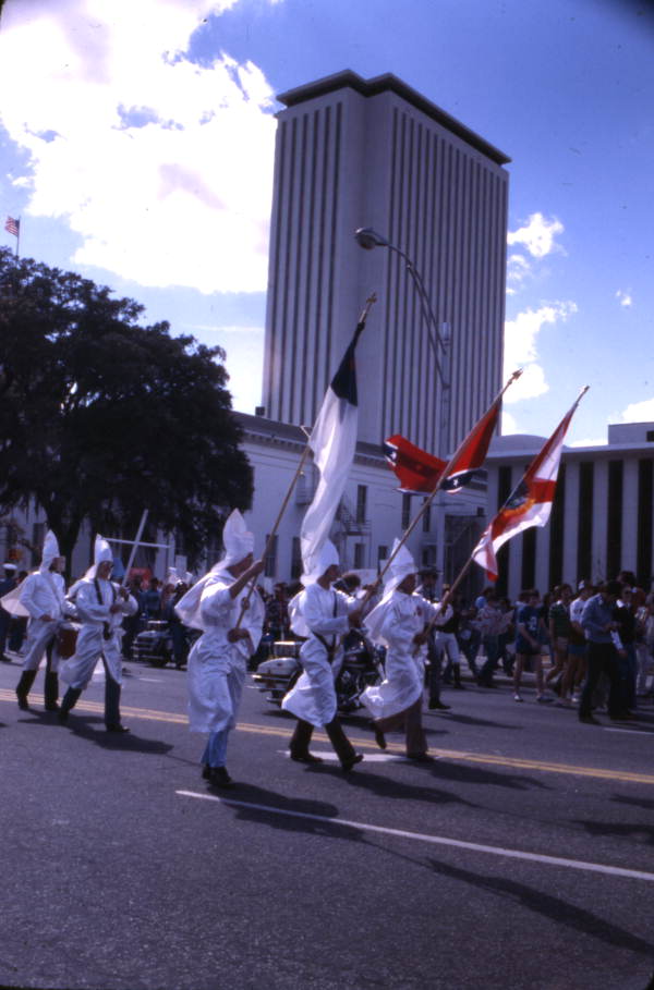 KKK members marching north on South Monroe Street during a rally in front of the Capitol building - Tallahassee, Florida.