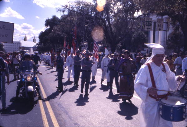 View showing KKK members marching north on South Monroe Street during a rally in Tallahassee, Florida.