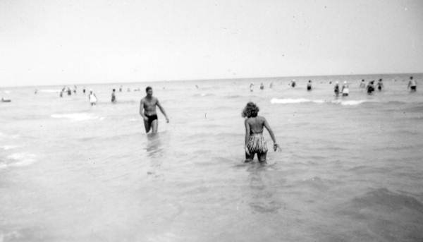 View showing people in the surf at the beach during their Florida vacation in Miami.