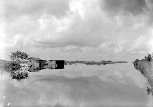 View of flooded house next to canal - Everglades, Florida.