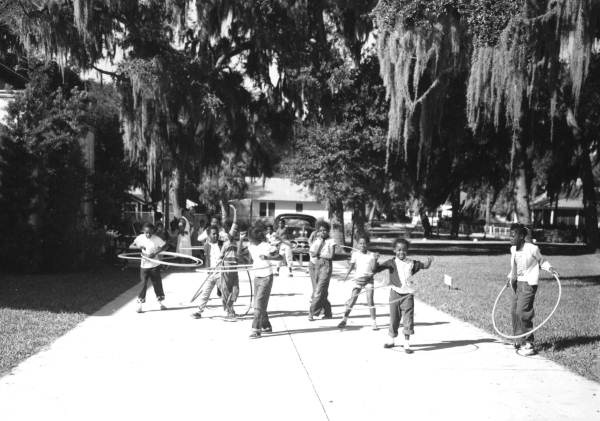 Boys and girls with hula-hoops