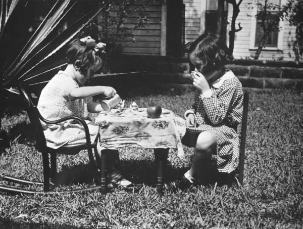 Blanche and Mary Pat Weedon playing tea party