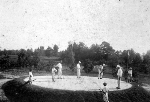 Golf players and caddies in Tallahassee.