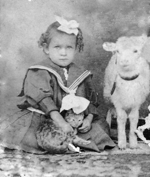 Hazel Harrell with her cat and lamb.