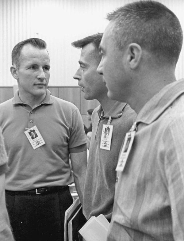 Astronauts holding a discussion prior to a mission