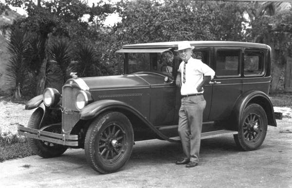 Man standing beside an automobile in Miami
