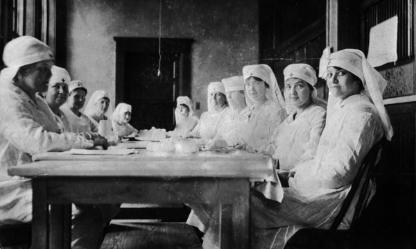 Red Cross volunteers rolling bandages