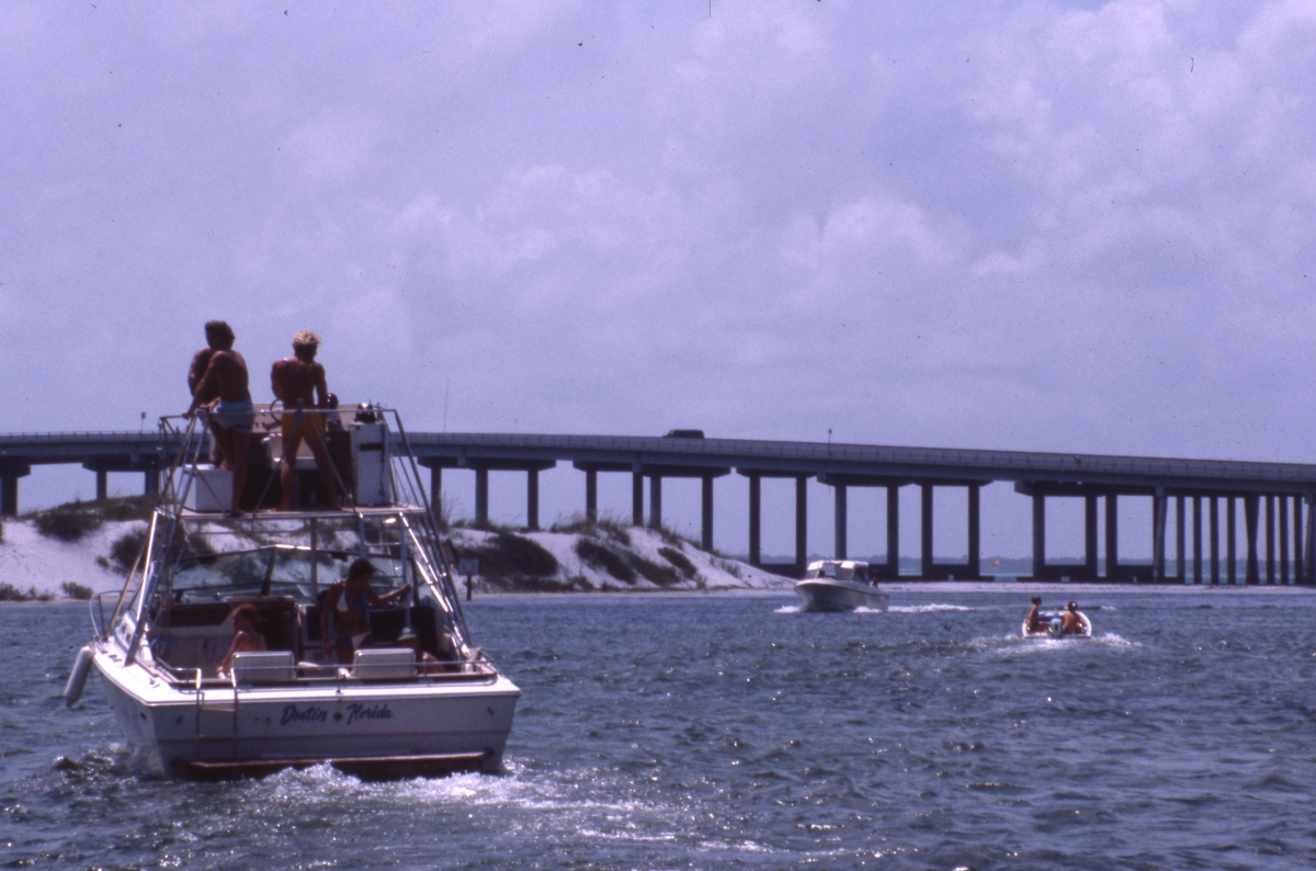 Boating in the East Pass channel by bridge - Destin, Florida