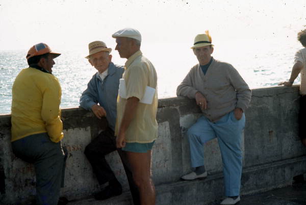 Men stand at the South Beach Pier - Miami, Florida