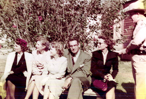 Governor Dan McCarty and his wife sitting with women