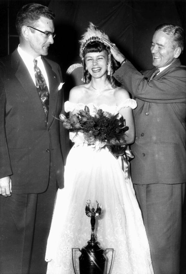 Governors Dan McCarty, left, and Fuller Warren, right, crowning unidentified beauty queen