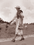 View of Izzelly Hardin, mid-wife, walking on the road - Riviera Beach, Florida.