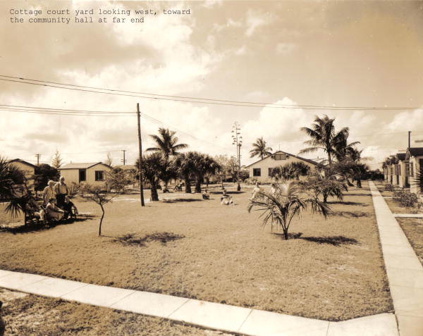 View looking west showing courtyard between cottages at Layton's Cottage, Trailer, and Fishing Park - Riviera Beach, Florida.
